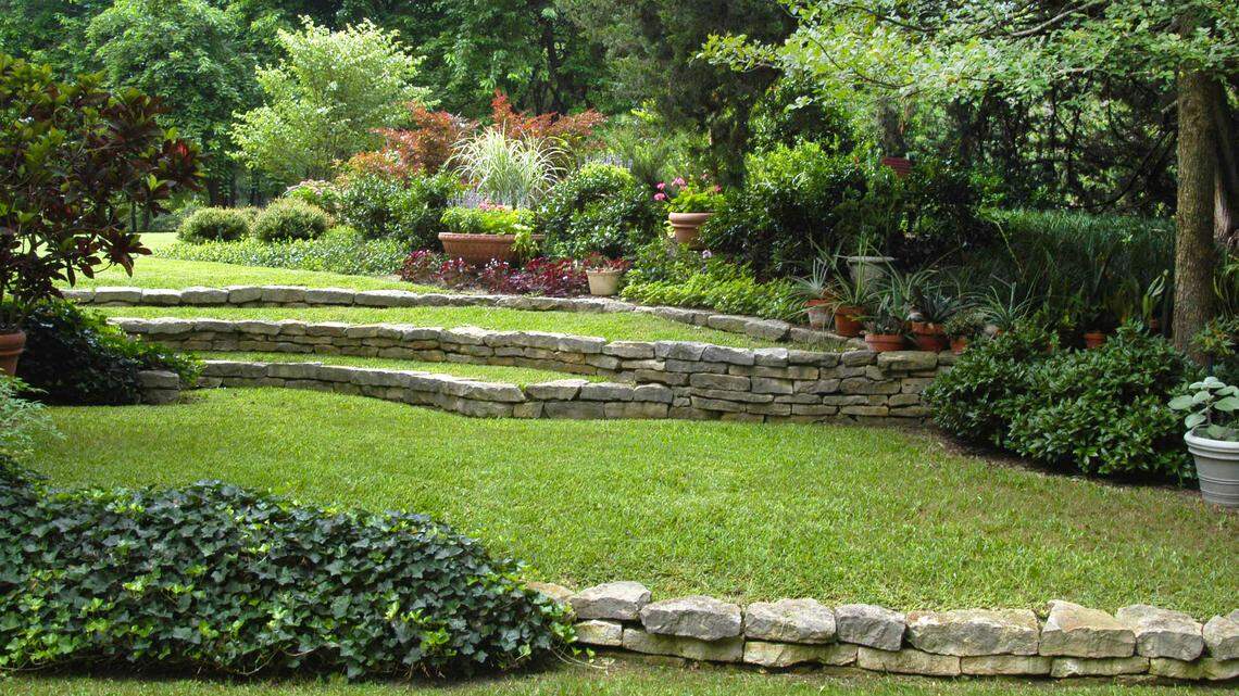 Retaining walls can be used on a large berm or hill in your landscape.