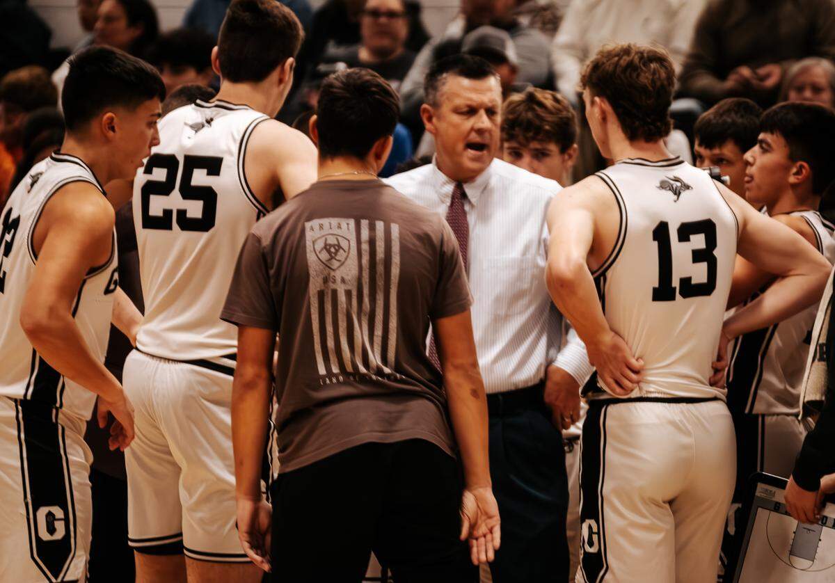 Graford head coach Jeff Bell huddles with his players during a timeout in a game against the De Leon Bearcats where the Jackrabbits would win 90-34 on Friday, Dec. 20, 2024. It was Bell’s 1,000th career win. (Photo courtesy of: Jordan Bell)