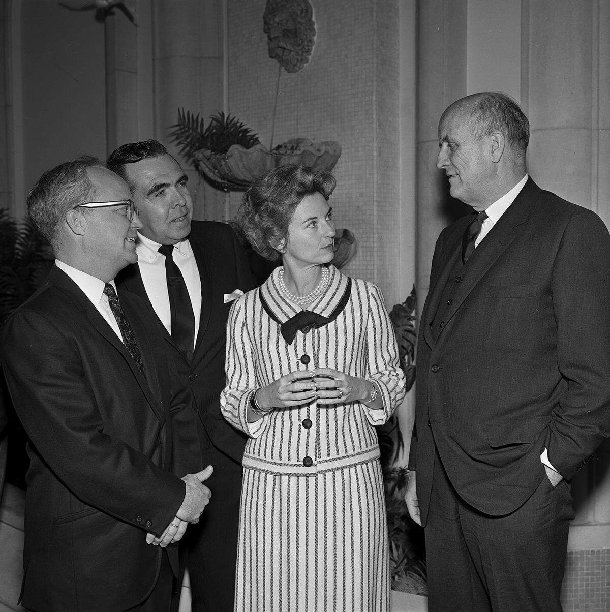 Members of the 1966 Community Arts Fund Campaign, from left: Whitfield J. Collins, Ned James, and Mrs. J. Lee Johnson III confer with Roger L. Stevens.