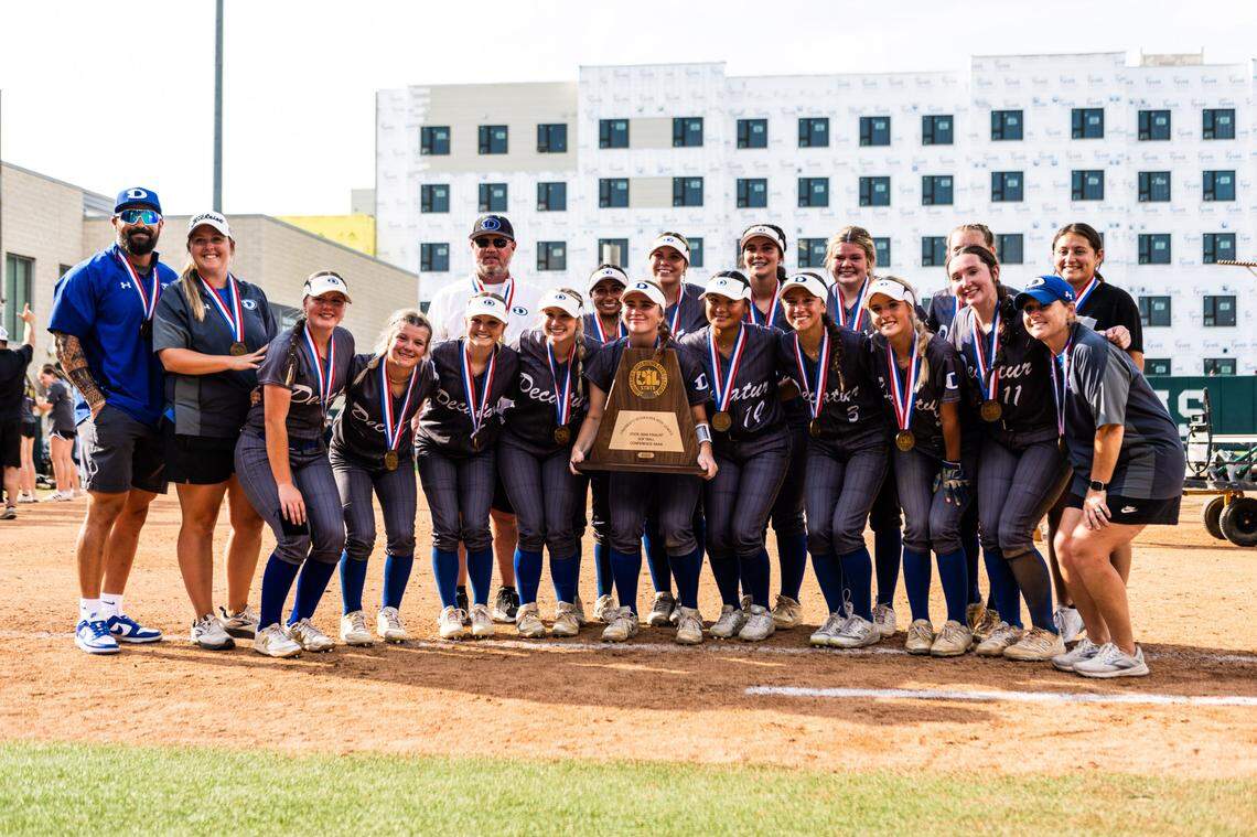 The Decatur softball team poses with their state semifinalist trophy and medals after losing to Liberty in the Class 4A state semifinals on Thursday, June 1, 2023 at McCombs Field in Austin, TX.