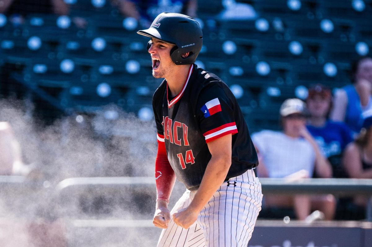 Connor Parlin (14) celebrates after sliding safely into home plate during the 5A UIL Baseball state semifinal between Mansfield Legacy and Friendswood at Dell Diamond in Round Rock on June 09, 2022.