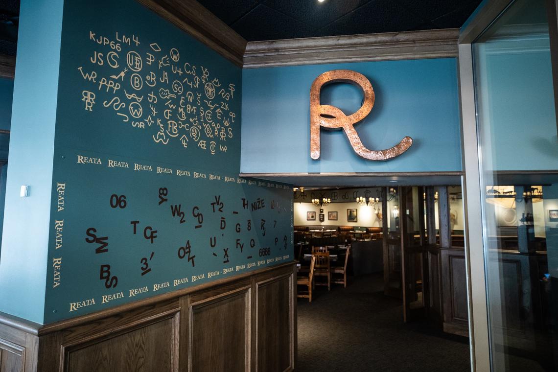 A wall of symbols and magnetic characters on a wall Friday, July 19 at Reata Restaurant in the Tower. Costumers are allowed to move the letters in a variety of patterns to create their own name for a Cattle brand.