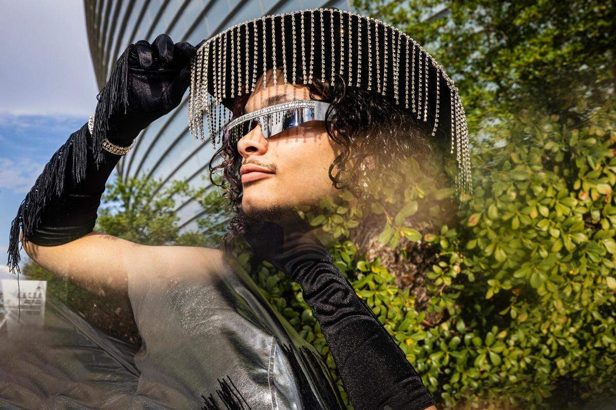 Amri Merrilo poses for a portrait with her facial accessories before entering Beyonce’s Renaissance World Tour at AT&T Stadium in Arlington on Thursday, Sept. 21, 2023.