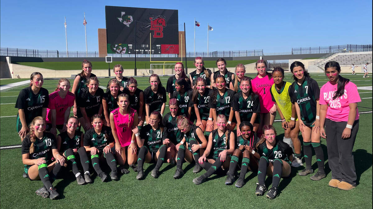 The Southlake Carroll girls soccer team poses after defeating Mansfield Legacy in a Class 6A Division 2 bi-district match on Friday, March 21, 2025 at Crowley ISD Multi-Purpose Stadium in Fort Worth, Texas.