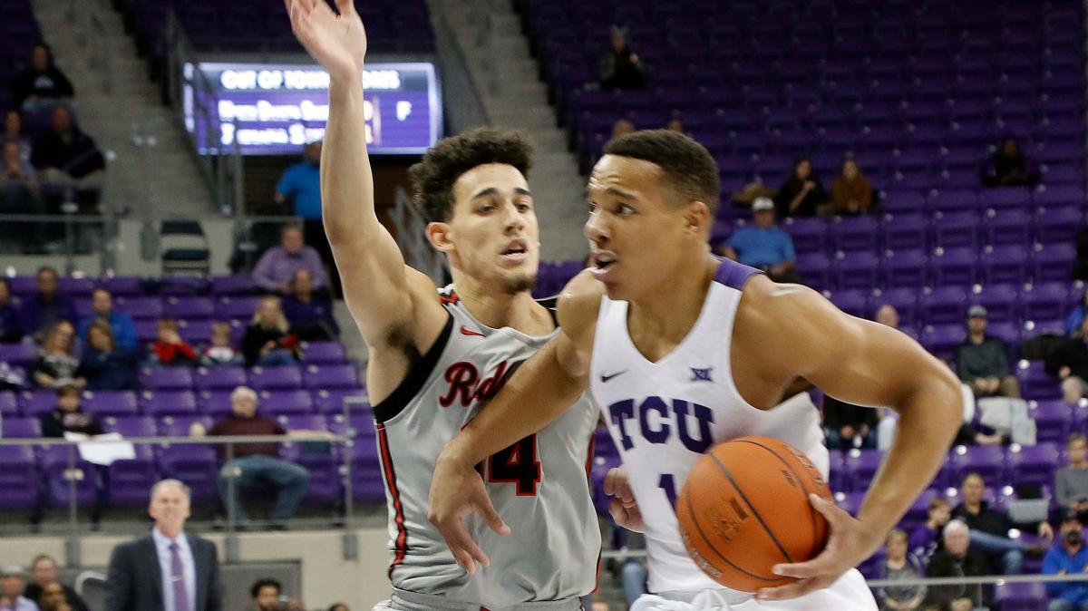 TCU guard Desmond Bane (1) drives by Illinois State guard Hank Beard (14) in the first half Tuesday at Scholllmaier Arena in Fort Worth.