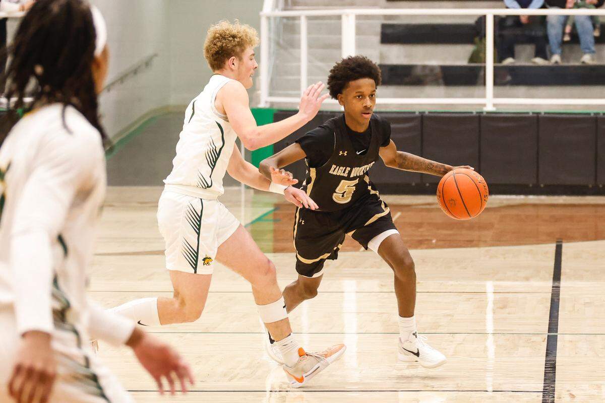 Eagle Mountain’s Terry Cromer looks for room against Benbrook in a Class 4A Division 2 bi-district game on Monday, February 17, 2025 at Azle High School. Eagle Mountain won 60-48.