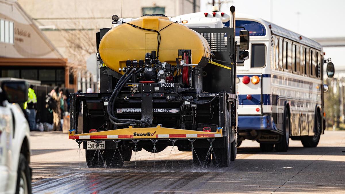 A brine truck sprays its solution on the street in preparation for the winter storm on Presidio Street in Fort Worth on Wednesday, Jan. 8, 2024.