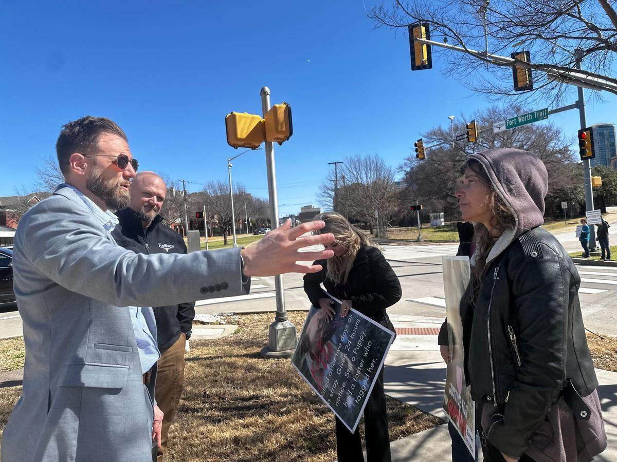 Director of Code Compliance Brian Daugherty talks with a group of animal rescue advocates outside Fort Worth City Hall on Tuesday, March 4.