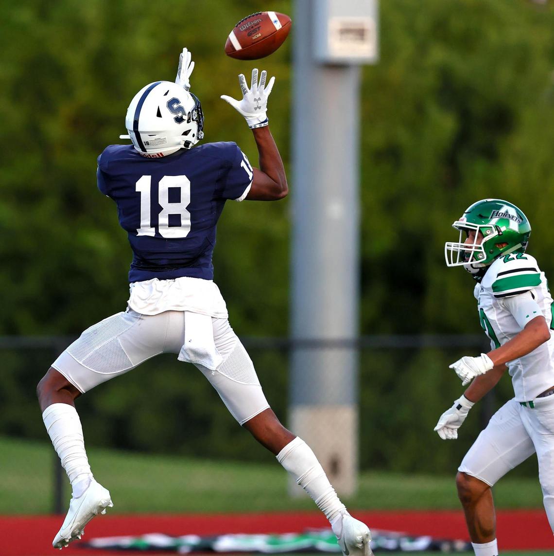 All Saints receiver Ben Patterson (18) comes up with a reception in front of Azle defensive back Chase Laxamana (22) during the first half, Friday night, September 25, 2020 played at All Saints High School in Fort Worth, TX. (Steve Nurenberg Special to the Star-Telegram)