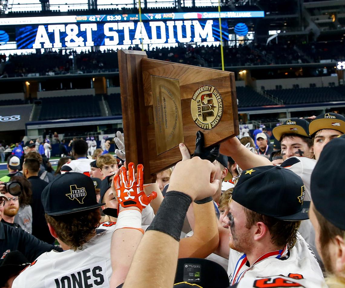 The Aledo Bearcats celebrate their 45-42 victory over Fort Bend Marshall in the 5A Division II high school football state championship game at AT&T Stadium in Arlington, Texas, Saturday, Dec. 21, 2019.