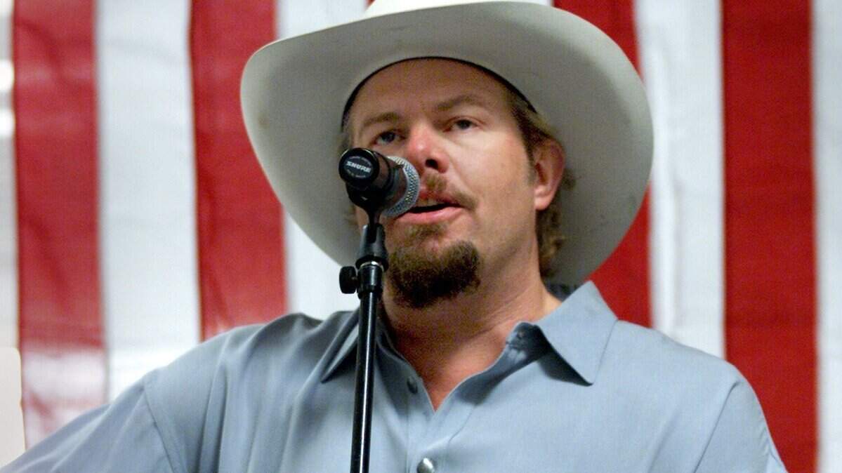 Country singer Toby Keith entertained fans at the Wal-Mart in North Richland Hills on July 28, 2002. Toby made an appearance to sing a song, sell CDs and sign autographs.