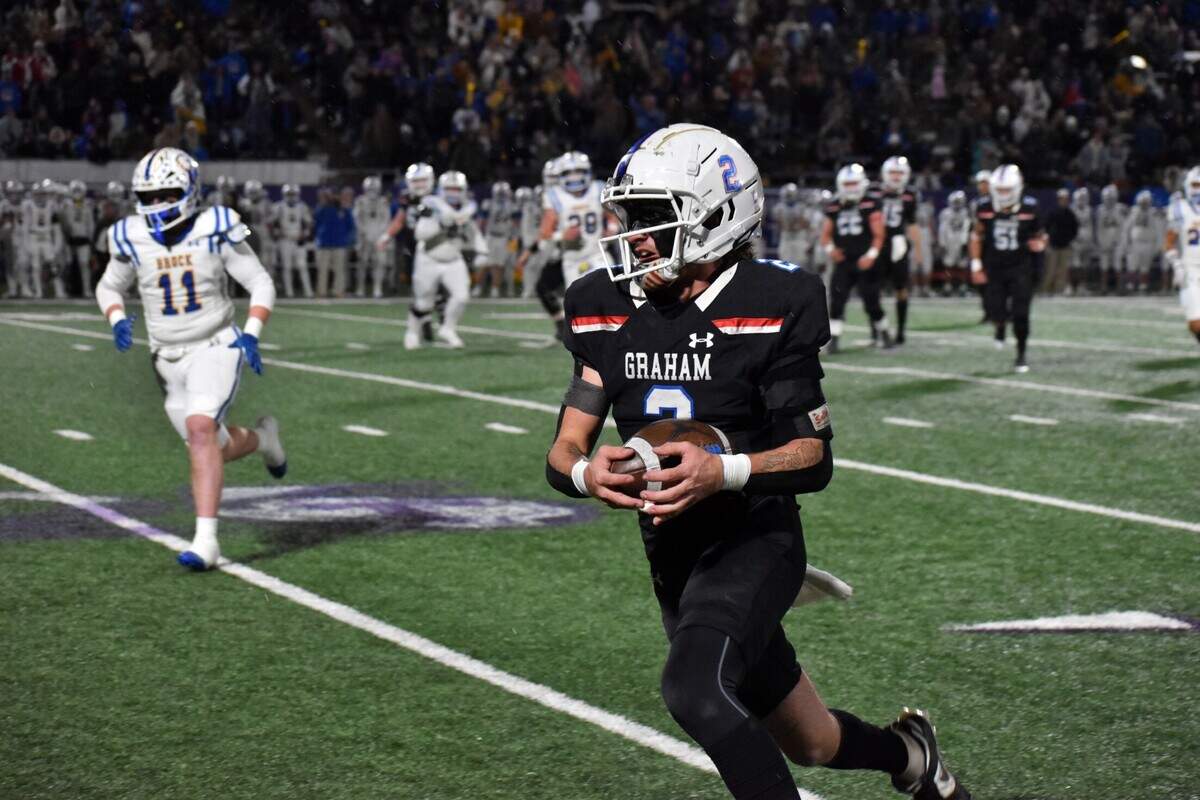 Graham running back Rylan Monsey hauls in a pass and runs for yardage in the first quarter of a UIL football Class 4 Division II regional final game against Brock at Tarleton Memorial Stadium on Friday, Dec. 6, 2024.
