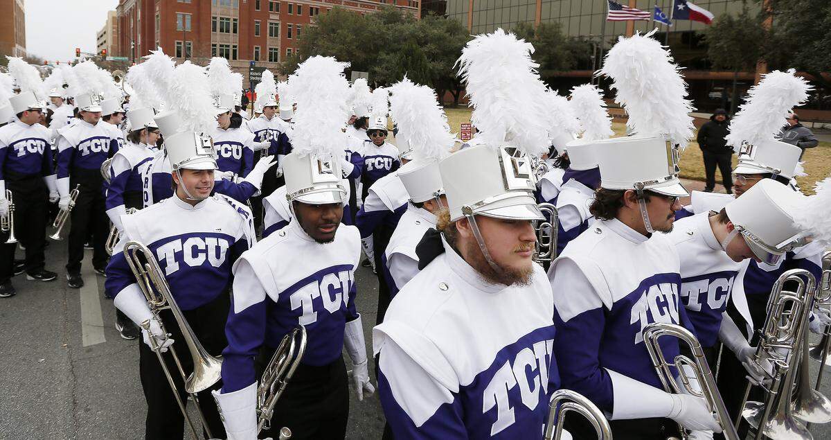The TCU band gathers at the start of the All-Western Parade in downtown Fort Worth on Saturday.