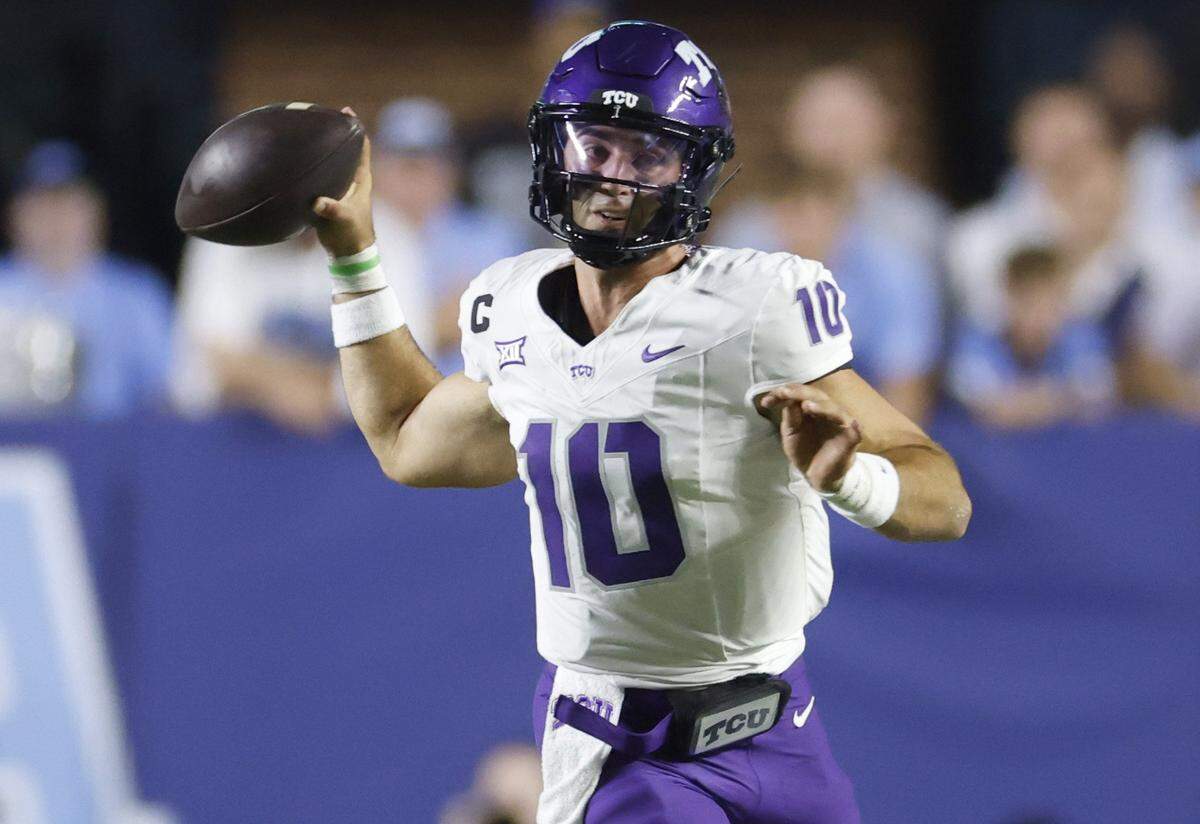 TCU quarterback Josh Hoover (10) looks for a receiver downfield during the first half Monday.