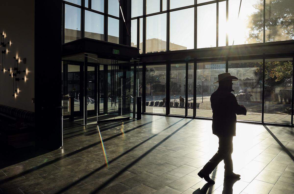 A guest walks across the new atrium of the southeast entrance of the Fort Worth Convention Center on Monday, Dec. 8, 2025, in downtown Fort Worth. The $95 million Phase 1 expansion included the lightbox atrium and terrance.
