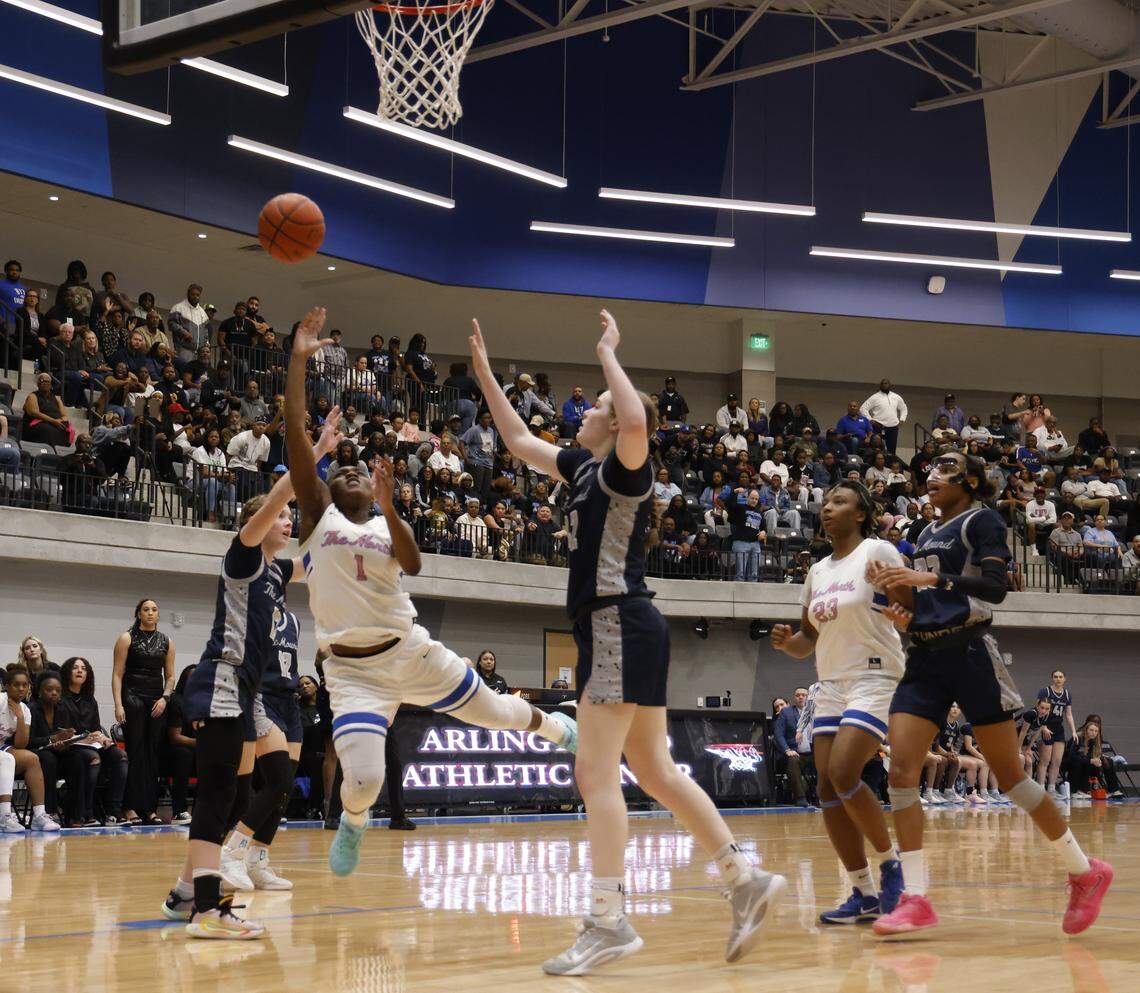 North Crowley guard Jamari Milton (1) attempts a lay up against Flower Mound during the second half of a UIL Class 6A Division I girls regional final basketball playoff game at Arlington ISD Athletics Center in Arlington, Texas, Friday Feb. 27, 2026.