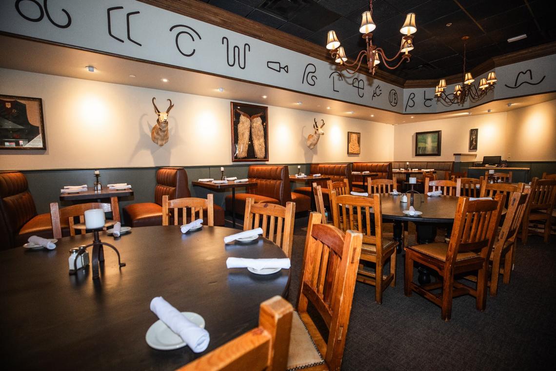 Cattle brands line across the wall at Reata Restaurant Friday, July 19. Each cattle brand is unique with symbols from well known ranches such as from the Television show Yellowstone with the four sixes and the restaurants own emblem.