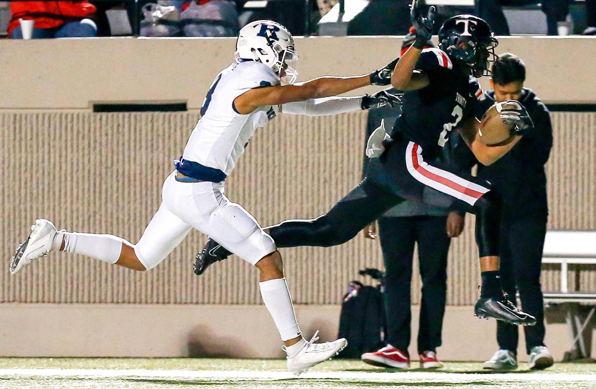 Euless Trinity running back Ollie Gordon (2) gets pushed out of bounds by Richland’s C.J. Baskerville (3) after a long run during the first half, Friday night, November 8 2019 played at Pennington Field in Bedford, TX.
