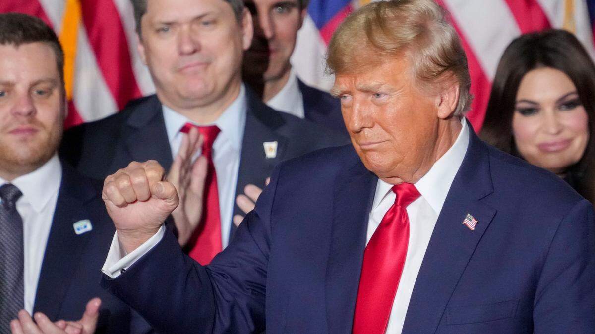 Former President Donald Trump celebrates his victory Monday in the Iowa Republican caucuses at an event in Des Moines.