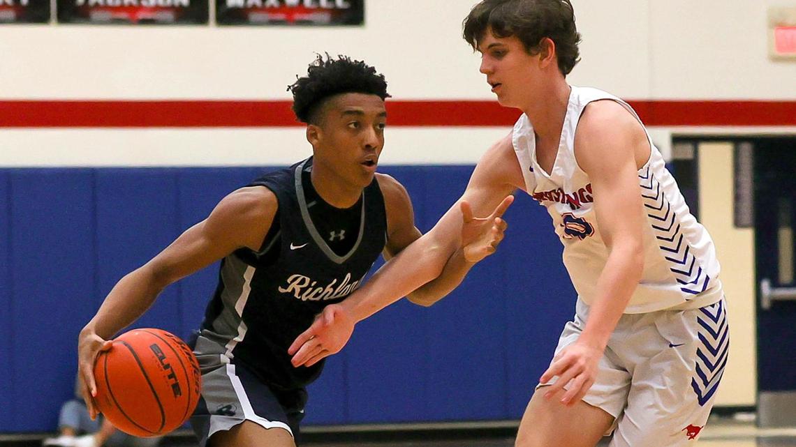 Richland guard Jourdyn Grandberry (1) tries to drive past against Grapevine forward Aaron Waggoner (r) during the second half of a High School basketball game, January 25, 2021, played at Grapevine High School in Grapevine, Tx. (Steve Nurenberg Special to the Star-Telegram)