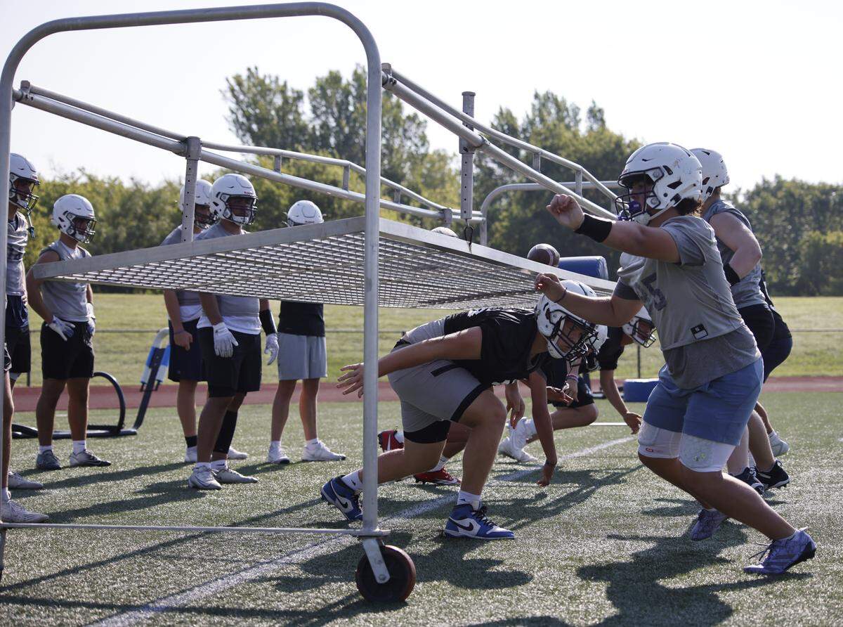 The defensive unit runs reaction drills during the first practice of 2025 for the All Saints in Fort Worth, Texas, Tuesday August, 05, 2025.