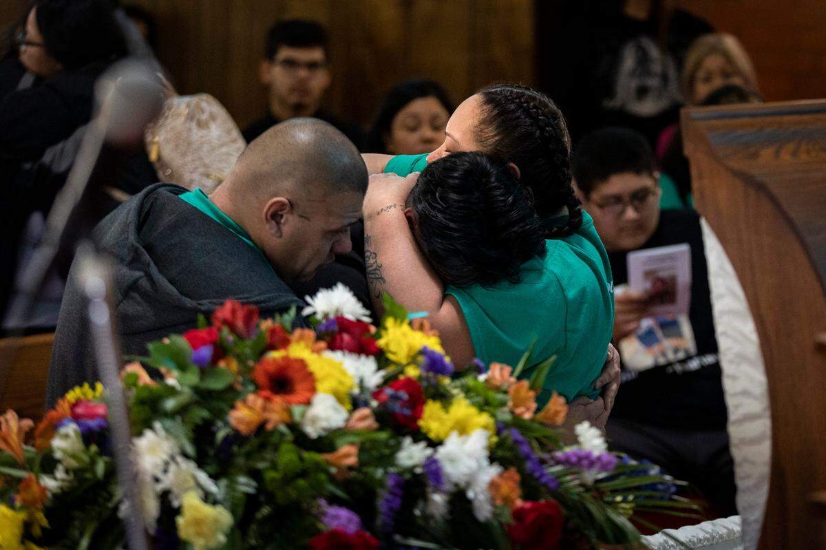 Erica Trevino comforts her son’s friend during his funeral in Waurika, Oklahoma, on Saturday, Jan. 28, 2023. Zechariah Trevino, a 17-year-old Paschal High School junior, was killed in a shooting that injured his cousin outside Whataburger near the Fort Worth school on Jan. 20.