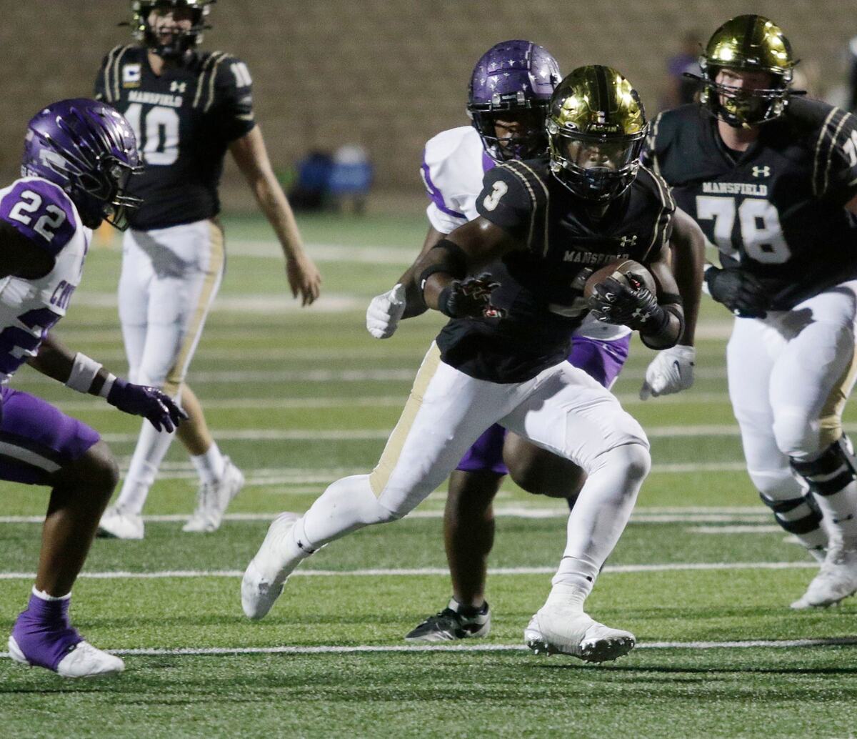 Mansfield’s Teddy Clark picks up yardage during a UIL football game at Newsome Stadium on Saturday , October 10, 2024.