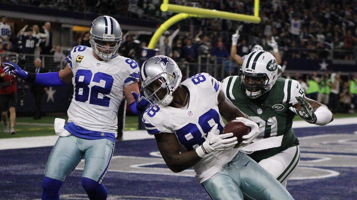 Dallas Cowboys wide receiver Dez Bryant (88) spins into the end zone ahead of New York Jets defensive end Sheldon Richardson (91) for a second-quarter touchdown at AT&T Stadium in Arlington, Texas, on Saturday, Dec. 19, 2015. (Paul Moseley/Fort Worth Star-Telegram/TNS)