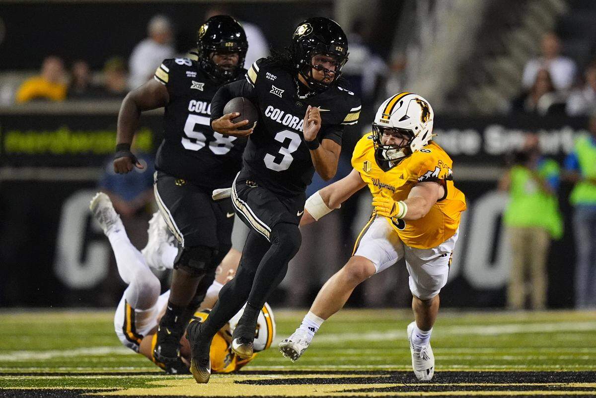 Sep 20, 2025; Boulder, Colorado, USA; Wyoming Cowboys linebacker Evan Eller (6) reaches for Colorado Buffaloes quarterback Kaidon Salter (3) in first quarter at Folsom Field. Mandatory Credit: Ron Chenoy-Imagn Images
