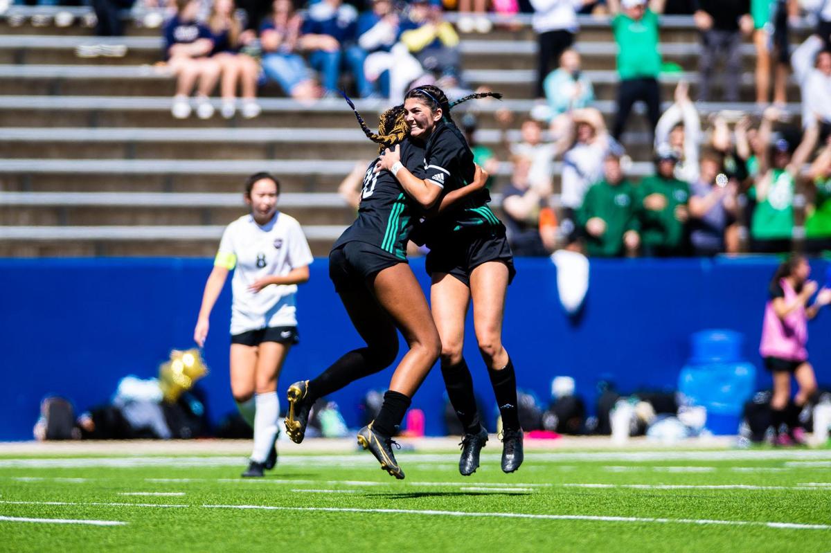 Zoe Matthews celebrates with Hannah Khan after a successful shot on the goal putting the Lady Dragons up 2-0 over the Marcus Marauders during the 6A Regional Final at McKinney ISD Stadium on April 9th, 2022.