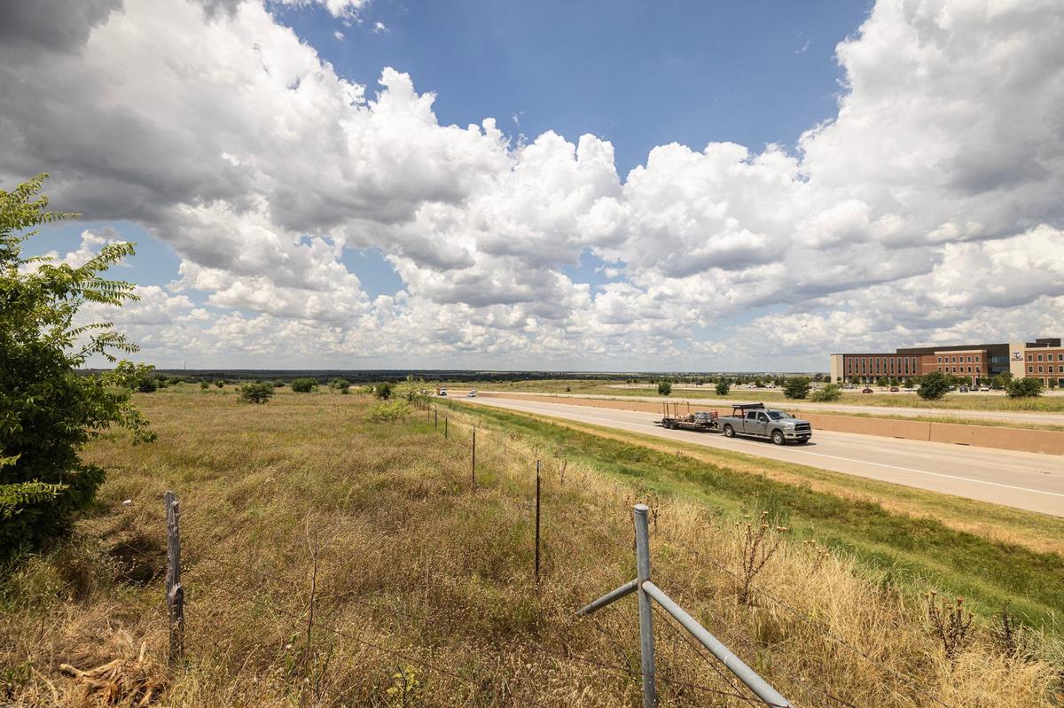 A plot of land off Old Granbury Road bordering the Chisholm Trail Parkway tollroad is the subject of a monthslong debate between developers hoping to construct a massive mixed-use development and a group of resistant nearby homeowners.