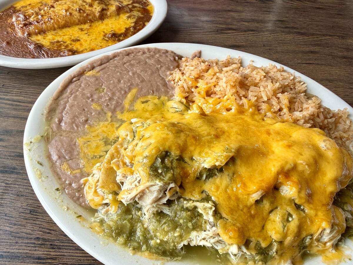 A chicken '‘enchilada pie” with green sauce, foreground, and a cheese enchilada with chili con carne at El Sombrero Restaurant in Saginaw, Texas, seen June 8, 2026.