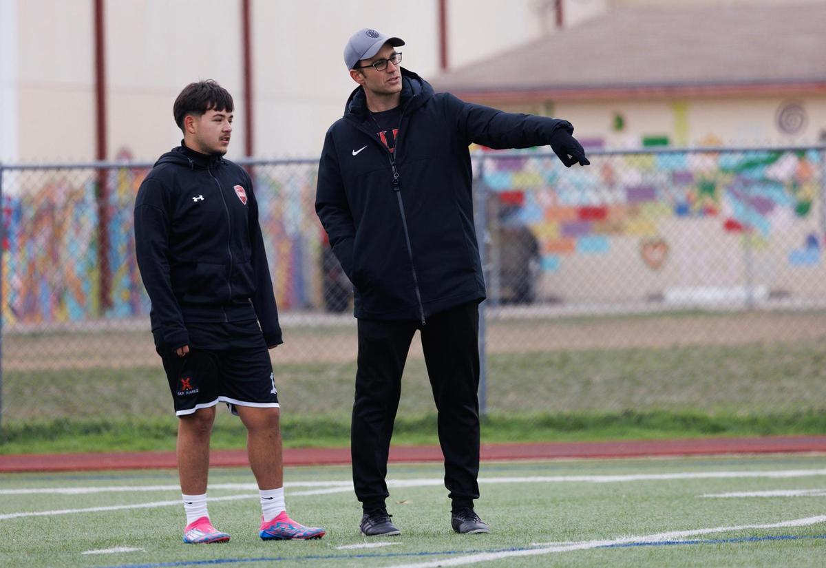 Diamond Hill-Jarvis coach Kyle Reopelle, right, talks with Edgar ‘Ronney’ Resendiz during practice with teammates on Thursday, Feb. 13, 2025, in Fort Worth.