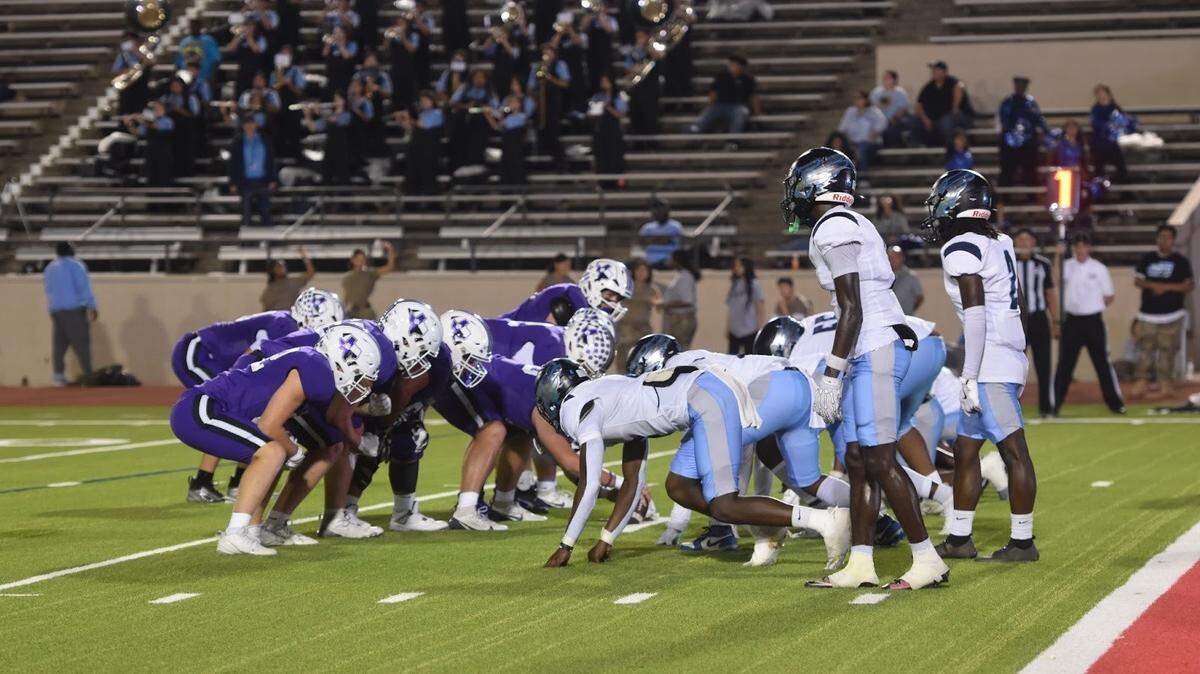 The Fort Worth O.D. Wyatt defense (right) faces off against Fort Worth Paschal on Thursday at Farrington Field. Wyatt won 37-31.
