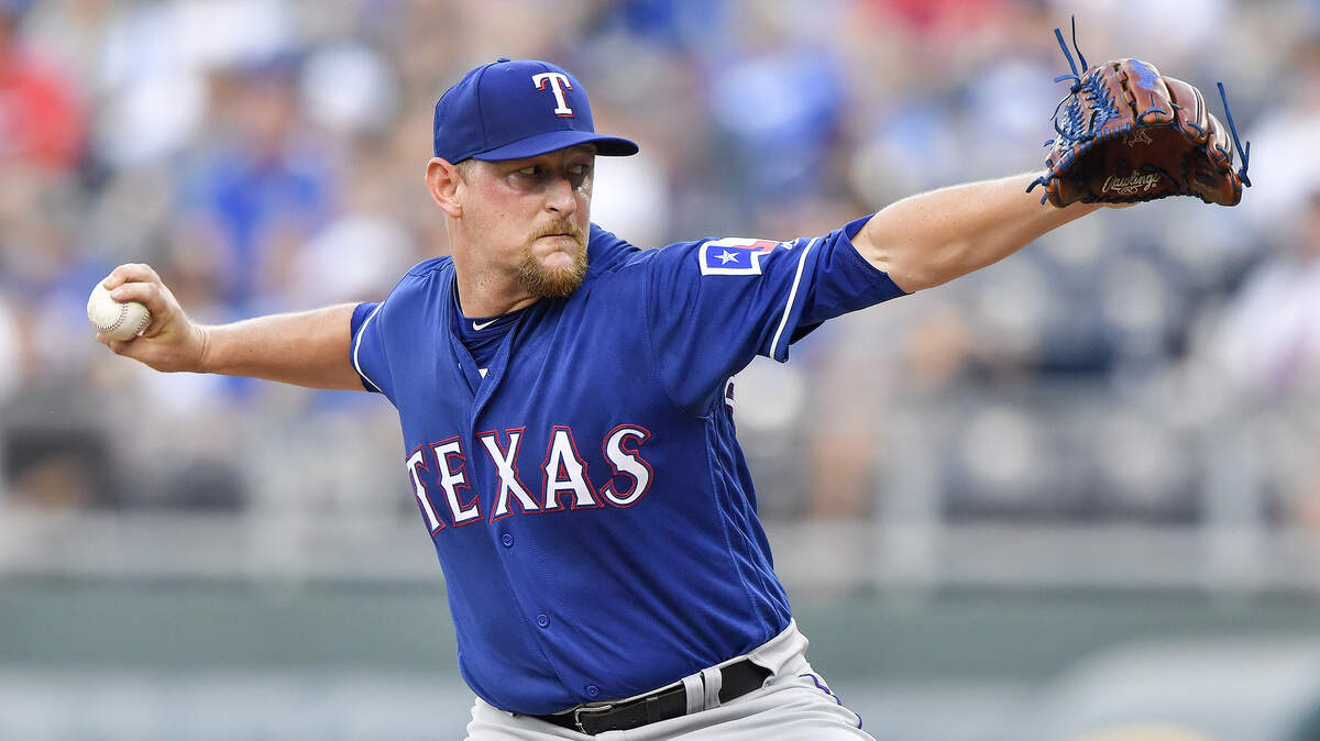 Texas Rangers starting pitcher Austin Bibens-Dirkx throws in the first inning against the Kansas City Royals on Wednesday, June 20, 2018, at Kauffman Stadium in Kansas City, Mo.