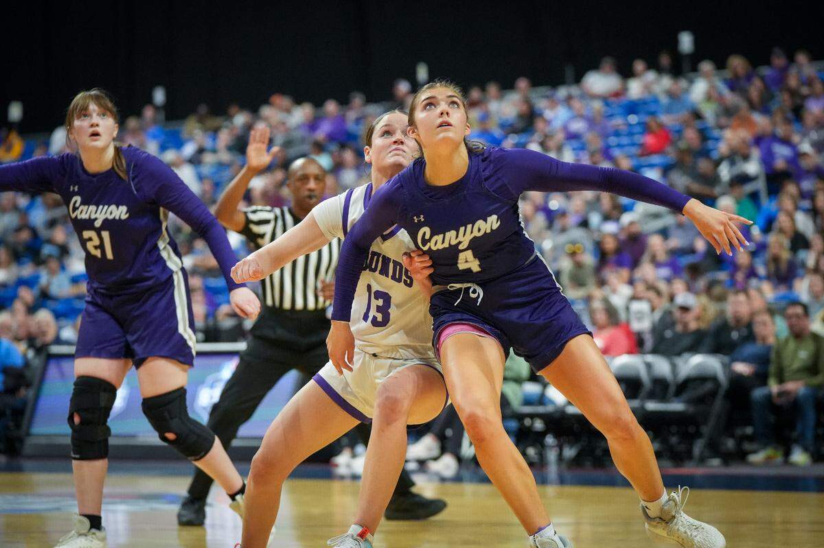 Canyon’s Sydnee Winfrey fights for rebound position with Boerne’s Meredith McLeod in a Class 4A state semifinal on Friday, March 1, 2024 at the Alamodome in San Antonio, Texas.
