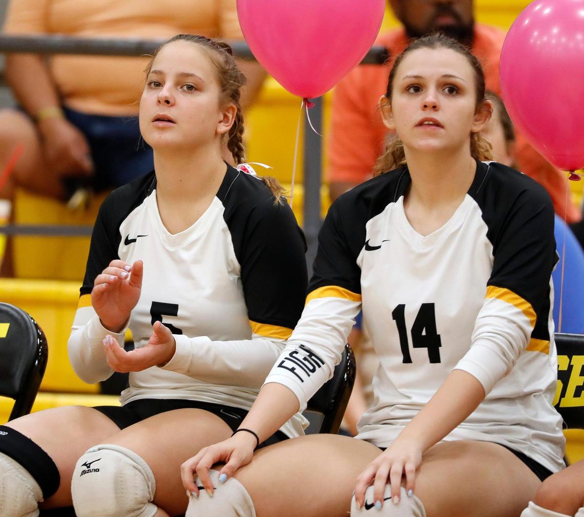 Fossil Ridge libero Ruslana Plaksii (5) supports her team sitting next to team mate middle hitter Emma Gilliland (14).