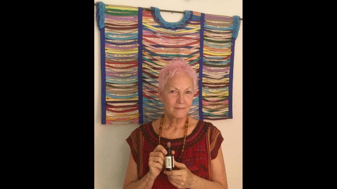 Lena Bartula holds a bottle of CBD oil the same size as the one she had when she was arrested.