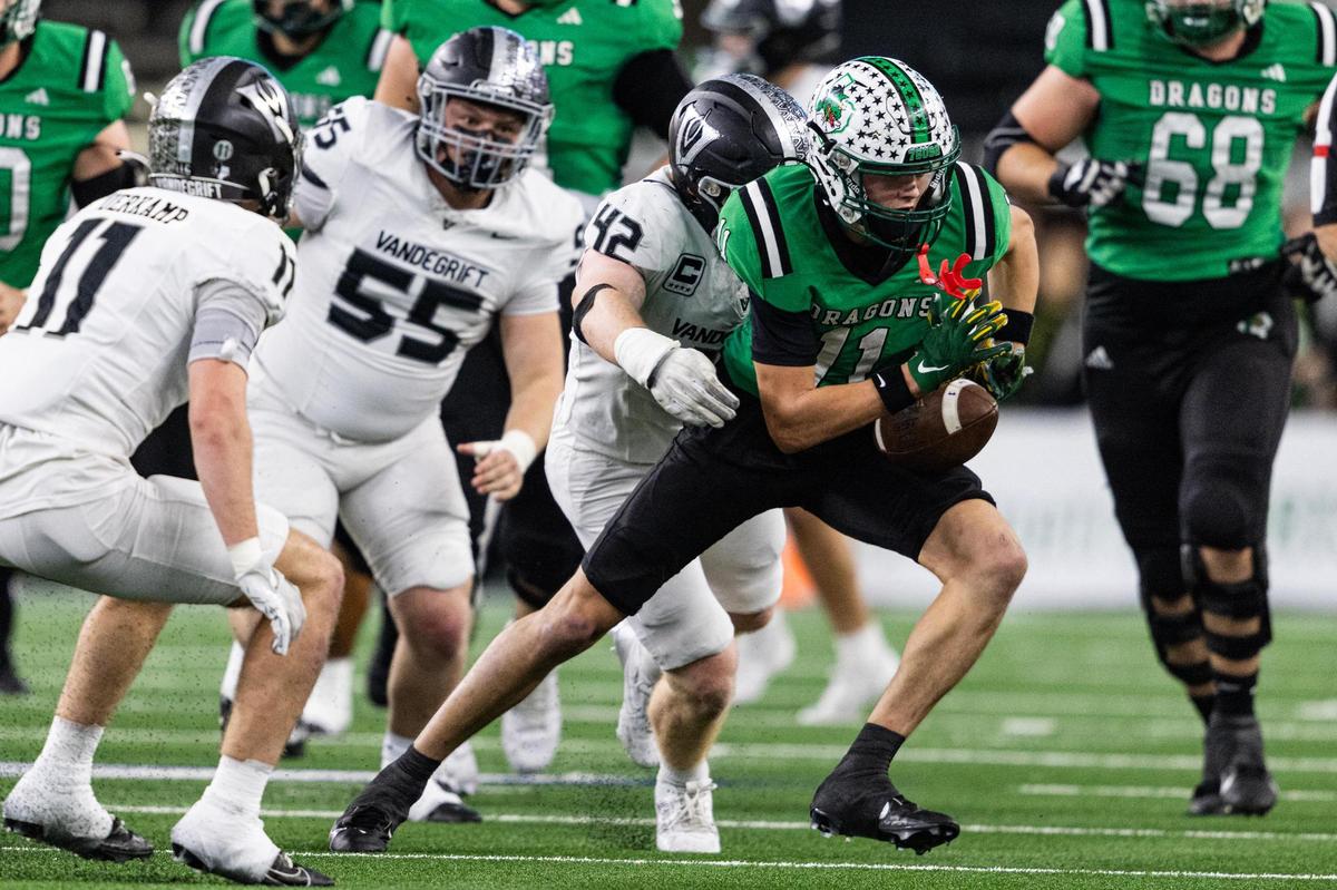 Southlake Carroll wide receiver Brock Boyd (11) fumbles the ball after a completion in the first half against Austin Vandegrift in the Class 6A Division II state championship game Dec. 21, 2024, at AT&T Stadium in Arlington.