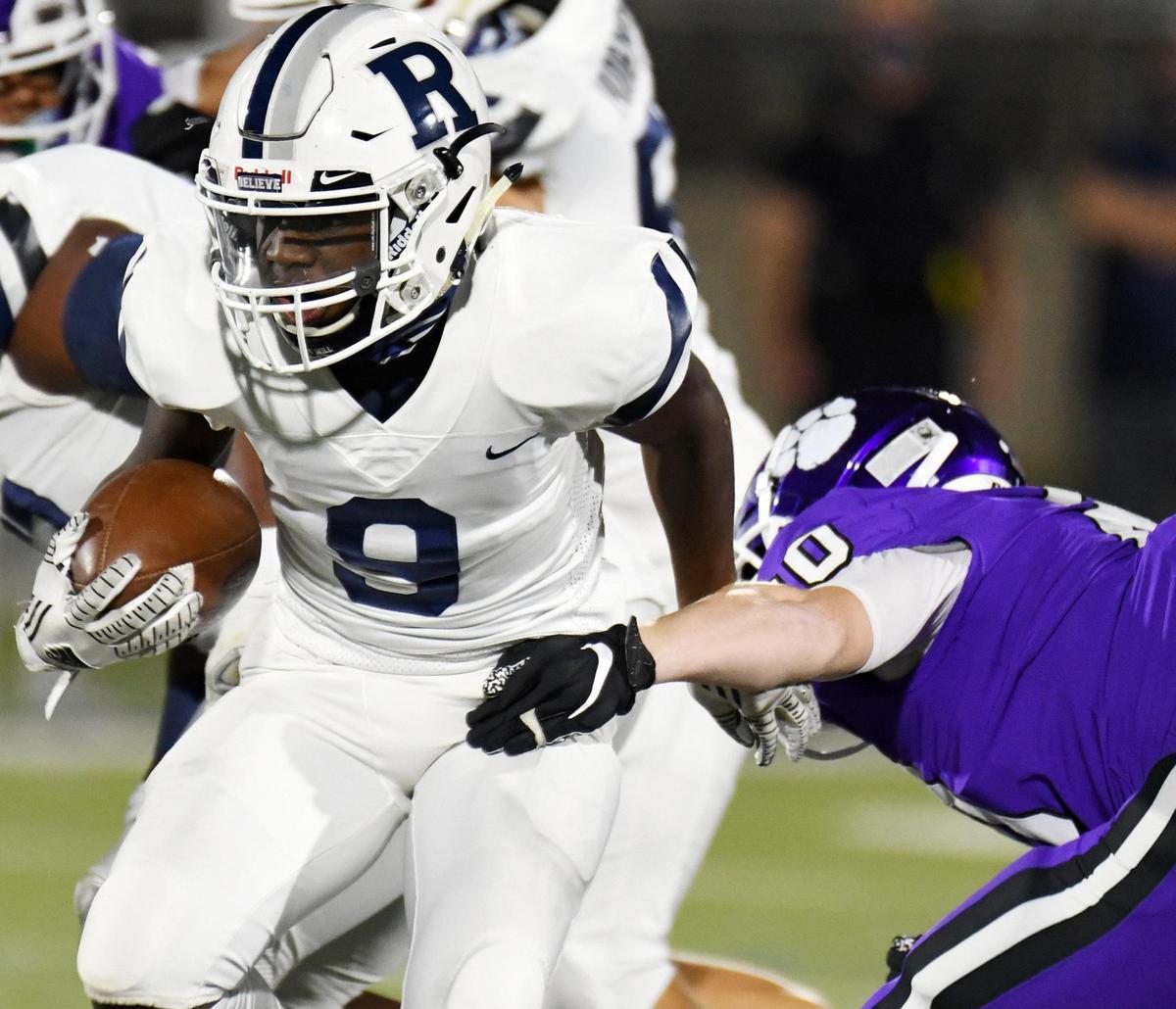 Richland’s Dominique, left breaks away from Paschal’s Matthew Transou as he takes the ball up the middle for a first down during the first quarter of their non-district football game Thursday, October 1, 2020 at Clark Stadium in Fort Worth, Texas. Special/Bob Haynes