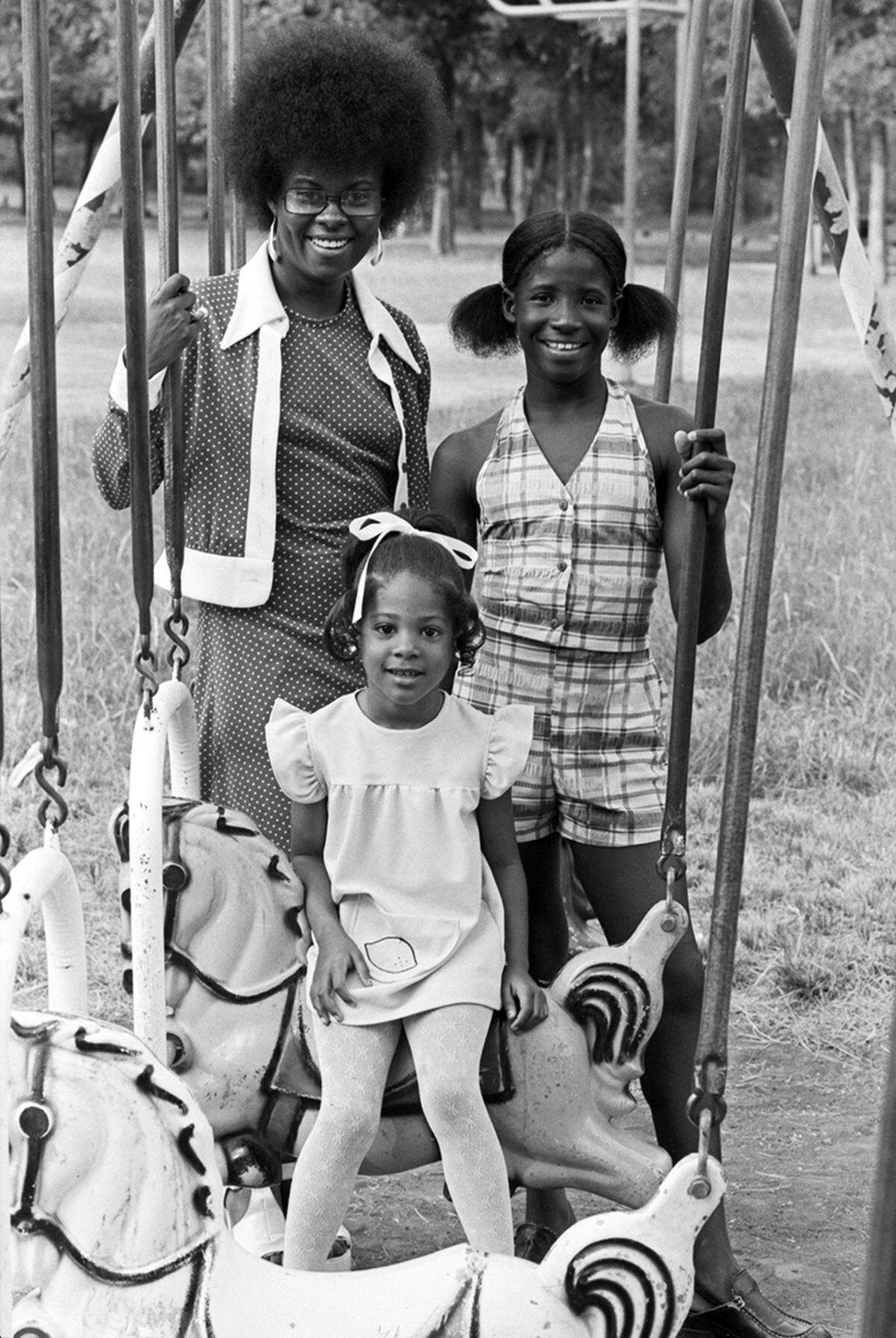 In 1974, Mona Thomas, left, Yolanda Lyons, right, and Tanja Broadus are three of the 30 contestants who have entered the Miss Juneteenth contest in Sycamore Park in Fort Worth.