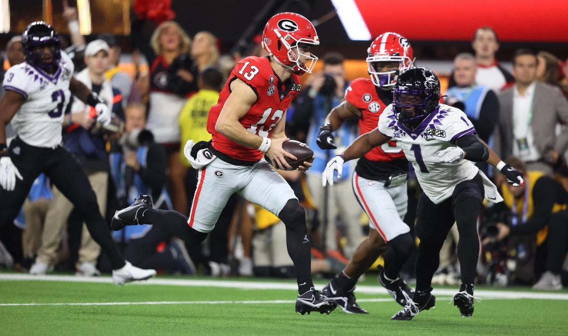 Georgia Bulldogs quarterback Stetson Bennett runs in for a touchdown in the first quarter against TCU during the College Football Playoff National Championship on Monday, Jan. 9, 2023, at SoFi Stadium in Inglewood, Calif.