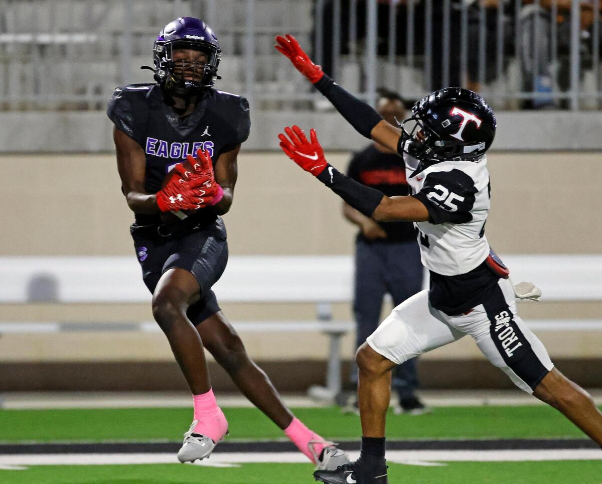 Crowley wide receiver Antayvious Ellis (1) grabs his second touchdown pass in front of Trinity defender Antwan McGee (25) in the first half of a UIL high school football game at Crowley ISD Multi-Purpose Stadium in Crowley, Texas, Friday, Oct. 20, 2023.
