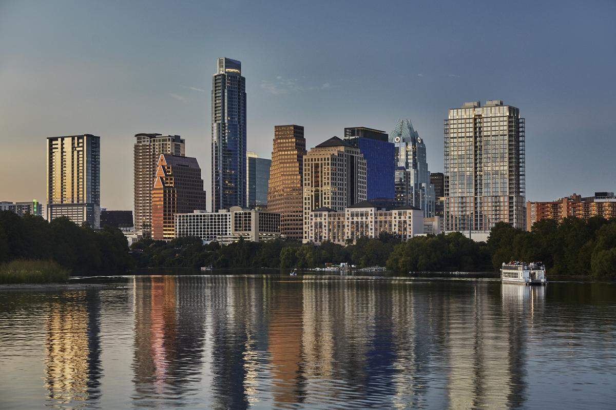 A view from Four Seasons Hotel Austin on Lady Bird Lake of the Austin city skyline.