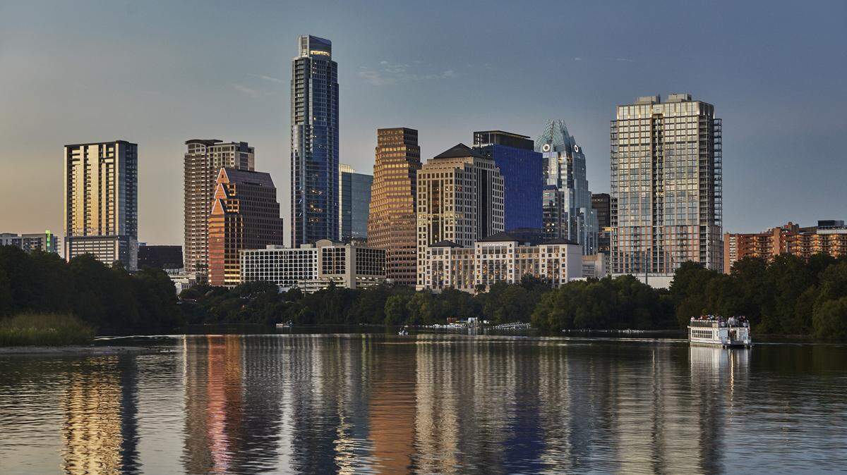 A view from Four Seasons Hotel Austin on Lady Bird Lake of the Austin city skyline.