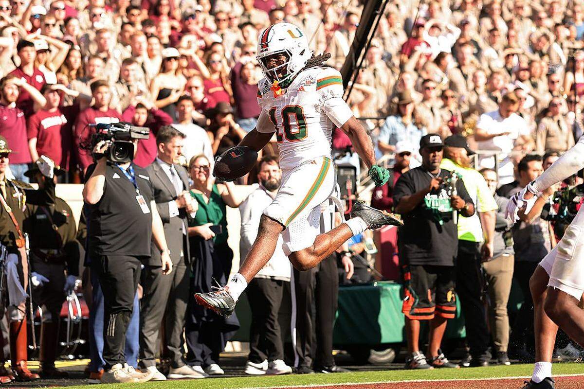 COLLEGE STATION, TEXAS - DECEMBER 20: Malachi Toney #10 of the Miami Hurricanes scores a touchdown in the fourth quarter against the Texas A&M Aggies during the 2025 College Football Playoff First Round Game at Kyle Field on December 20, 2025 in College Station, Texas. (Photo by Alex Slitz/Getty Images)
