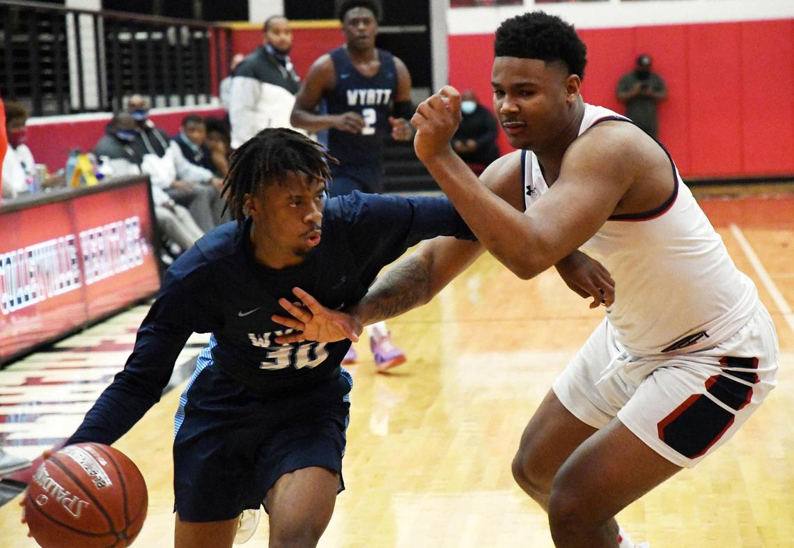 O.D. Wyatt’s Kendall Fair, left, drives towards the basket as Ryan’s Ja’Tavion Sanders defends during the second period of their 5A Region I Area playoff game Thursday, February 25, 2021 at Colleyville Heritage High School in Colleyville, Texas. Wyatt went on to win 59-44. Special/Bob Haynes