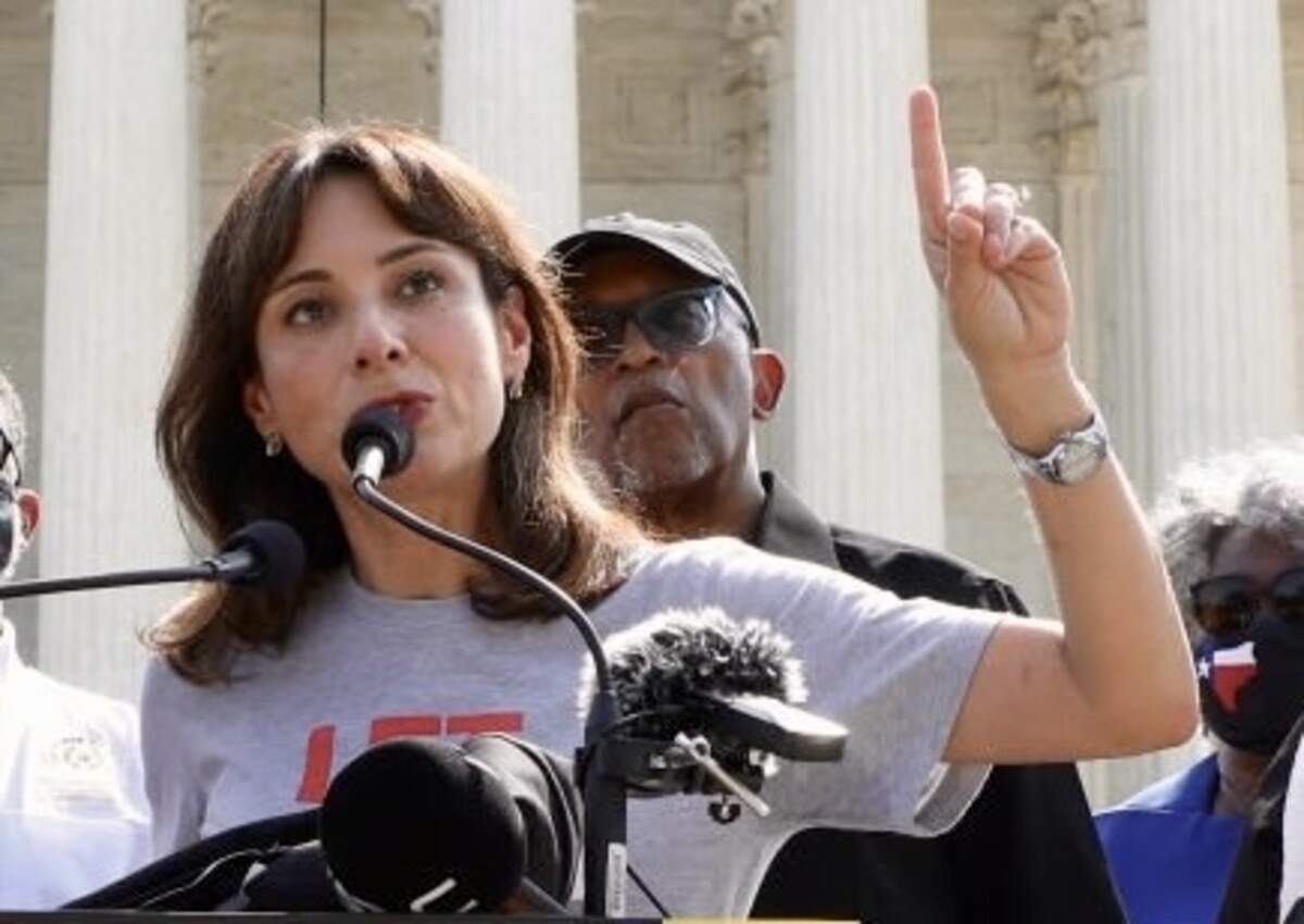 State Rep. Gina Hinojosa, D-Austin, speaks alongside fellow representatives and religious leaders in 2021 in Washington.