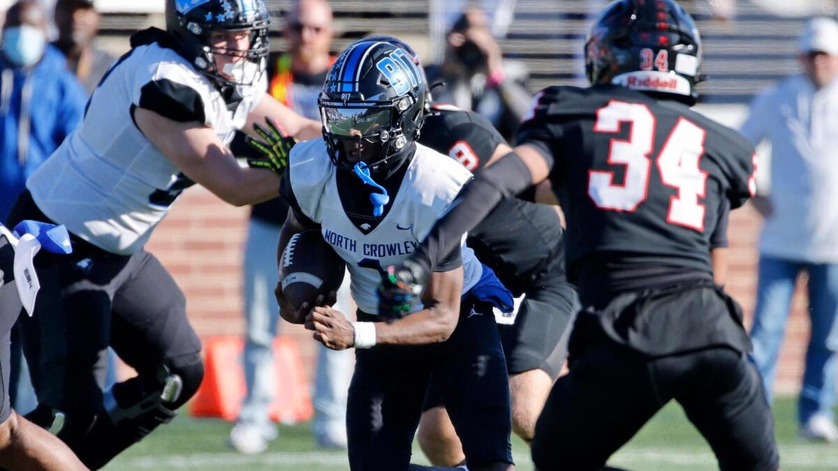 North Crowley running back Cornelius Warren (1) finds a hole up the middle during the UIL District 6A D1 Regional football game at Vernon Newsom Stadium in Mansfield, Texas, Saturday, Nov. 30, 2024.