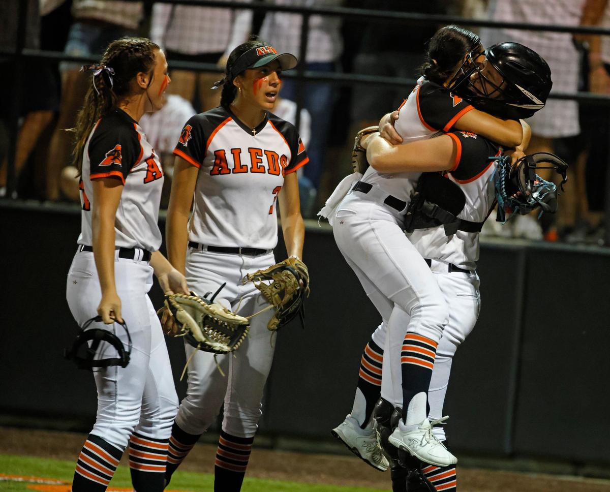 Aledo pitcher Brenlee Gonzales jumps into the arms of her catcher Breleigh Mayer after winning game one of the UIL Conference 5A Region 1 final softball game at Aledo, Texas, Wednesday, May 22, 2024.